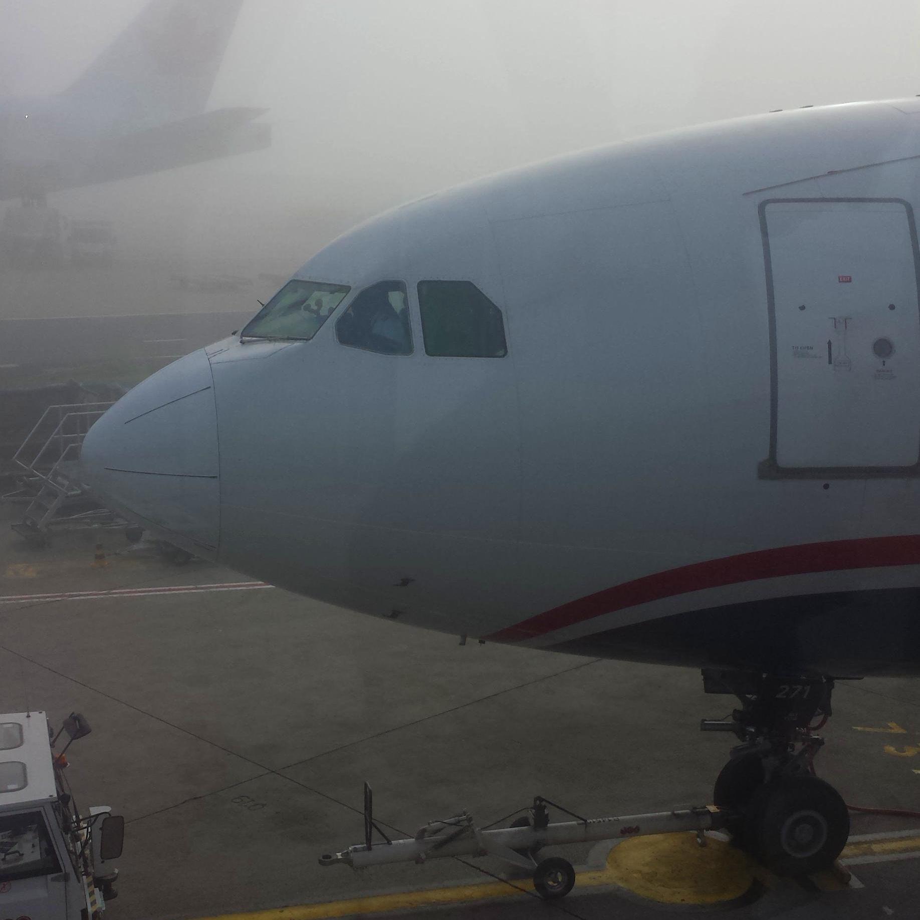 Photo of the forward section of a plane in a foggy airport